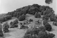 Oblique aerial view centred on Lochmaben Castle, showing excavations in progress