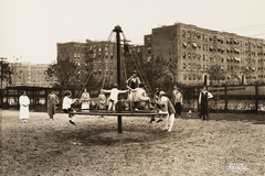 Children playing on roundabout in Jackson Heights