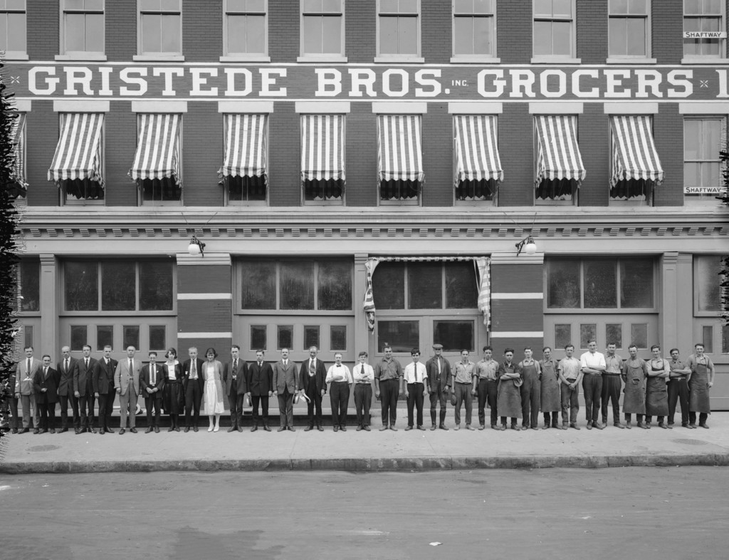 128th Street and Park Avenue. Gristede Bros., with group of people employees