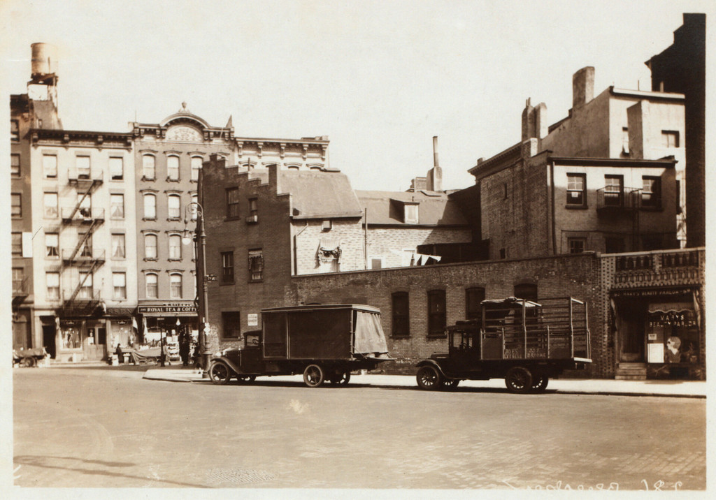 Seventh Avenue South, adjoining and at the S.E. corner of Bleecker Street