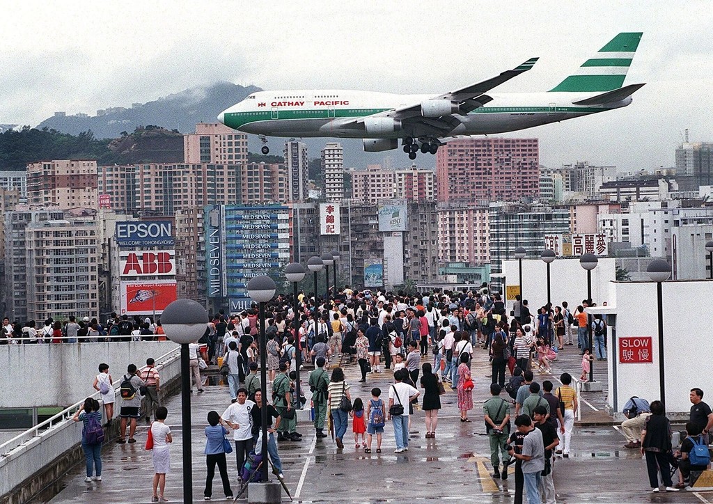 A Cathay Pacific flight comes into land in Hong Kong's Kai Tak Airport