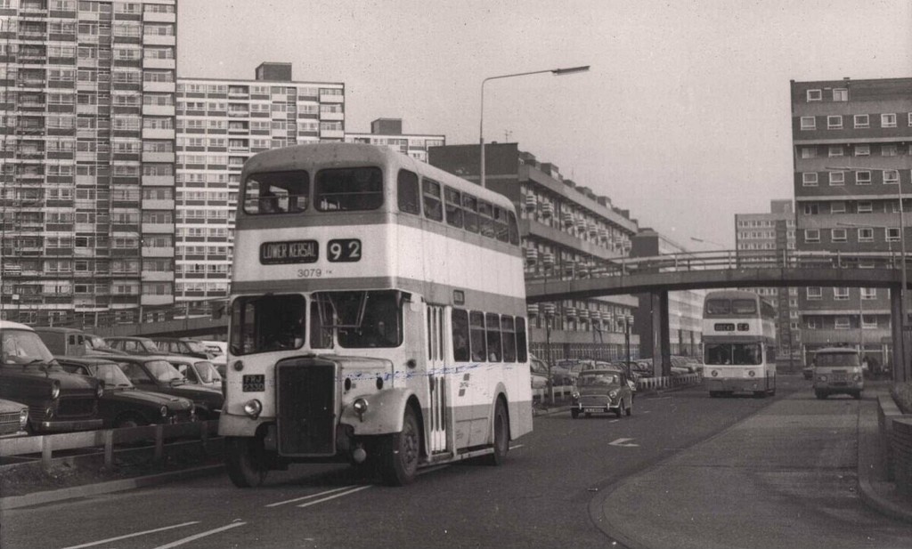 The number 92 bus heading back towards Lower Kersal at the side ofthe precinct