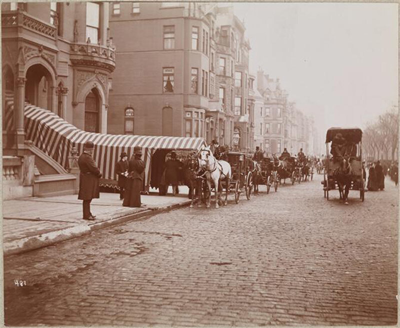 Horse-drawn carriages are lined up outside the house for the wedding of Anna Gould