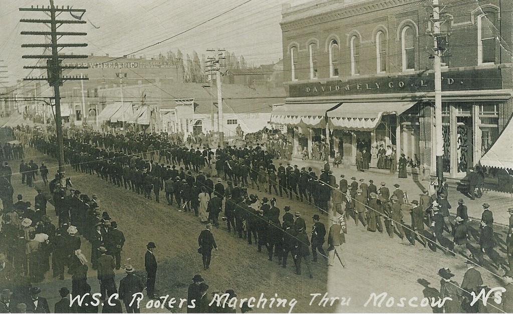 Washington State College Rooters (Fans) marching down Main Street in Moscow, Idaho