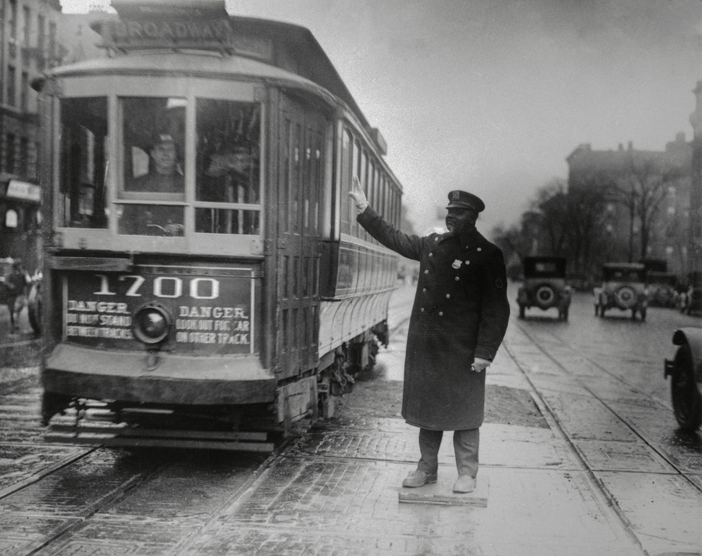 Traffic cop talking to trolley driver