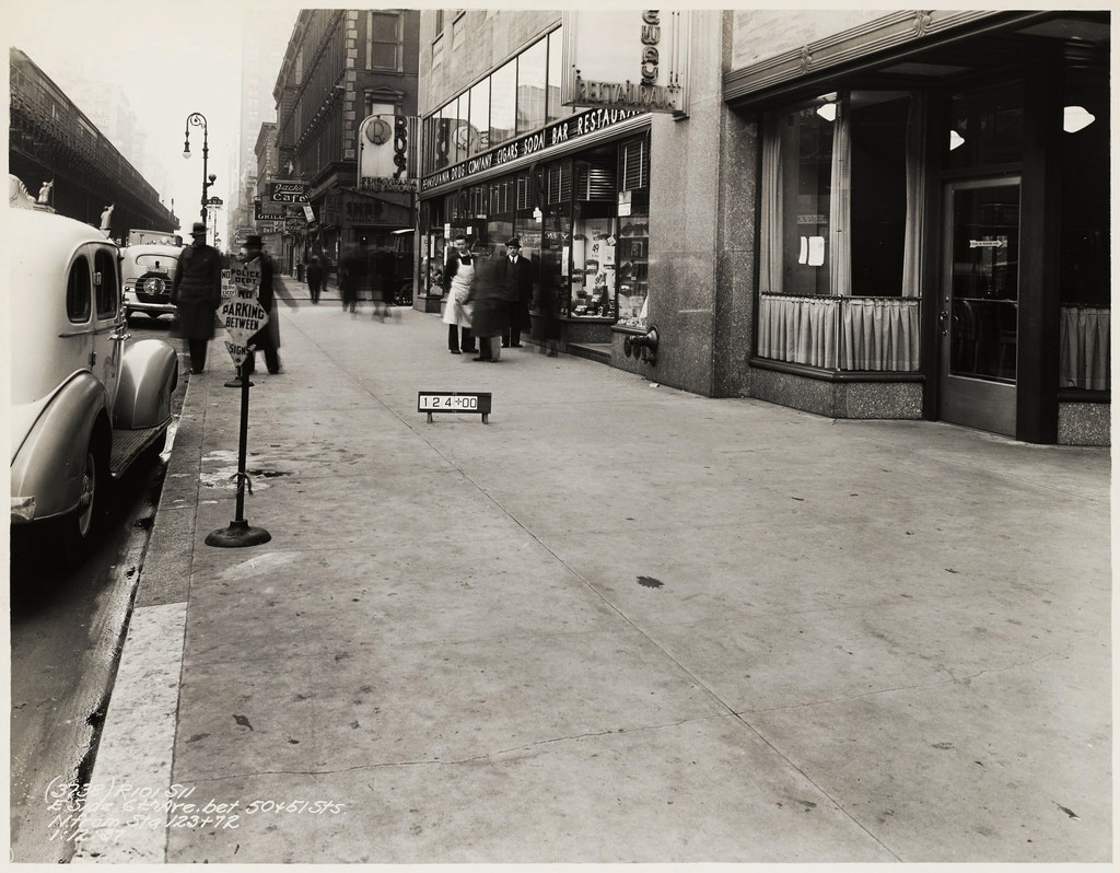 East side Sixth Avenue between West 50th Street and West 51st Street, north from