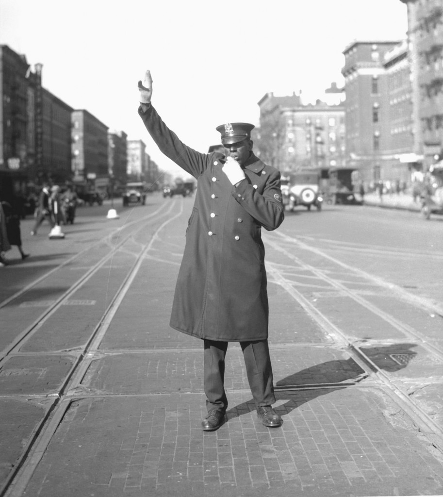 Negro traffic cop on West 135th Street and Lenox Avenue
