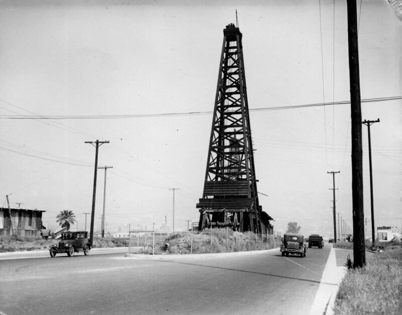 Oil derrick in the middle of the road