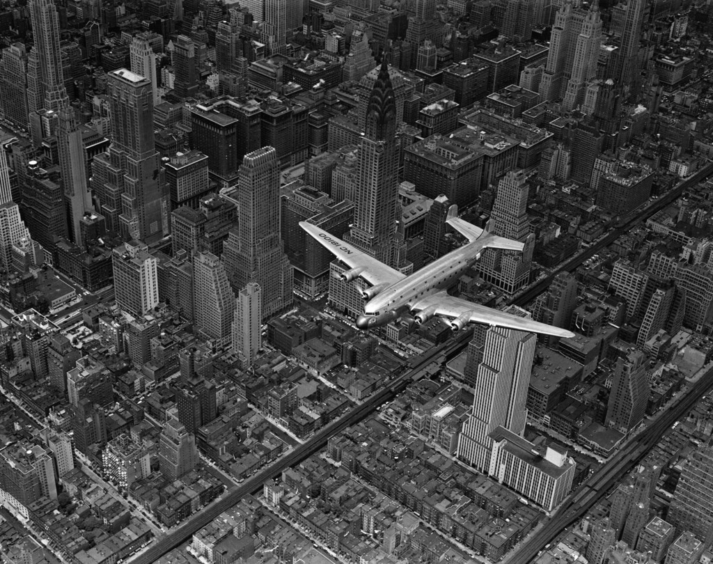 DC-4 flying over Manhattan