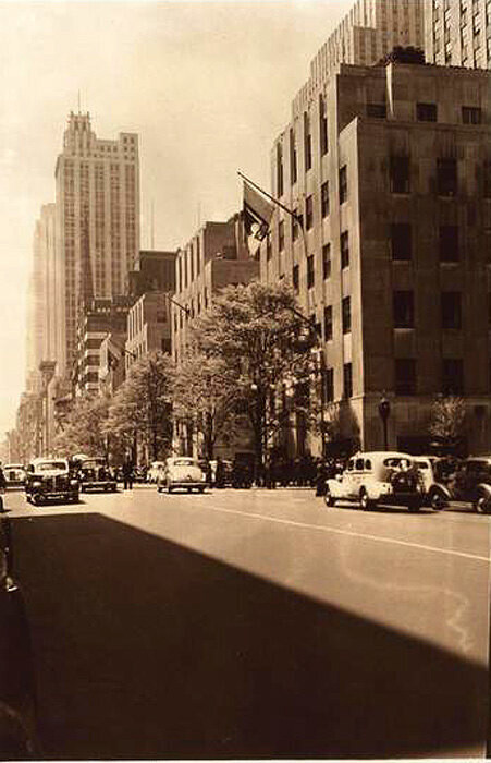Fifth Avenue east side south of 51st Street, showing trees of Rockefeller Center looking southwards.