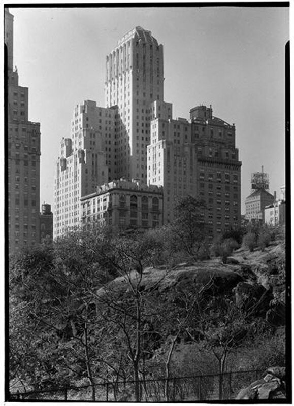 Barbizon Plaza Hotel. Exterior from Central Park over rock.