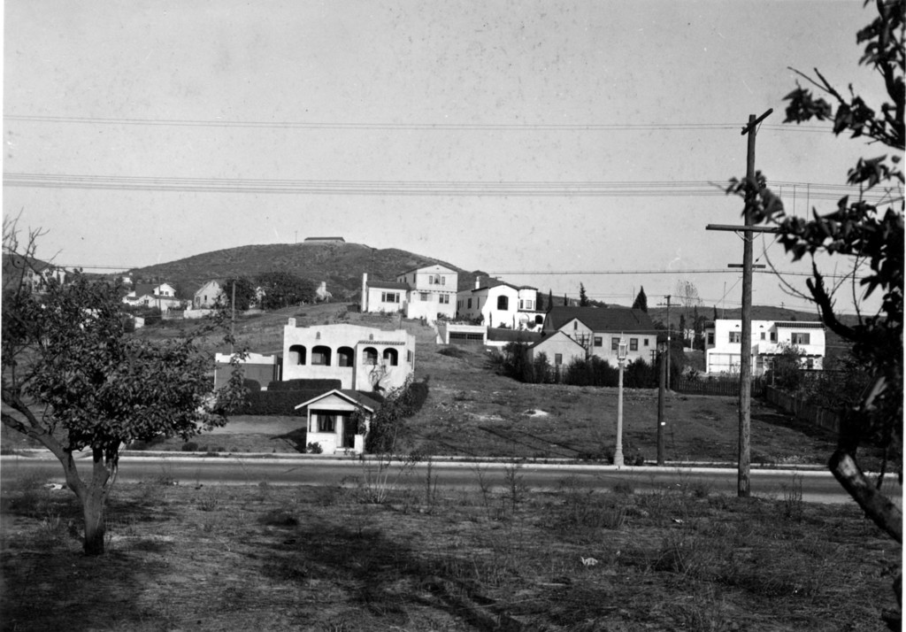Looking from southwest of McCarthy Drive and Verdugo Road, walnut trees, reservoir in background