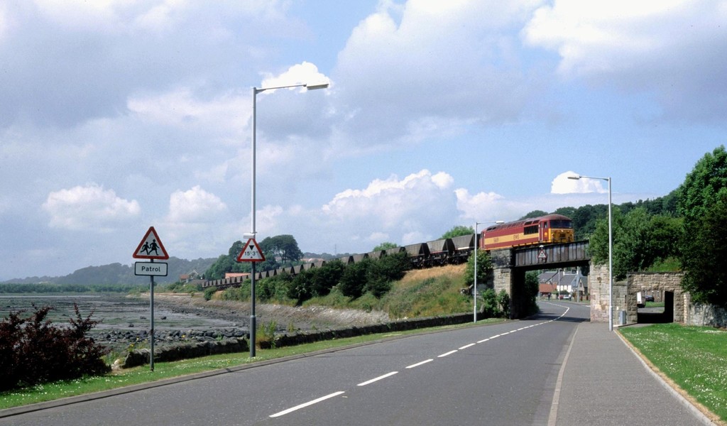 Train crosses the B9037 at Low Torry, Fife