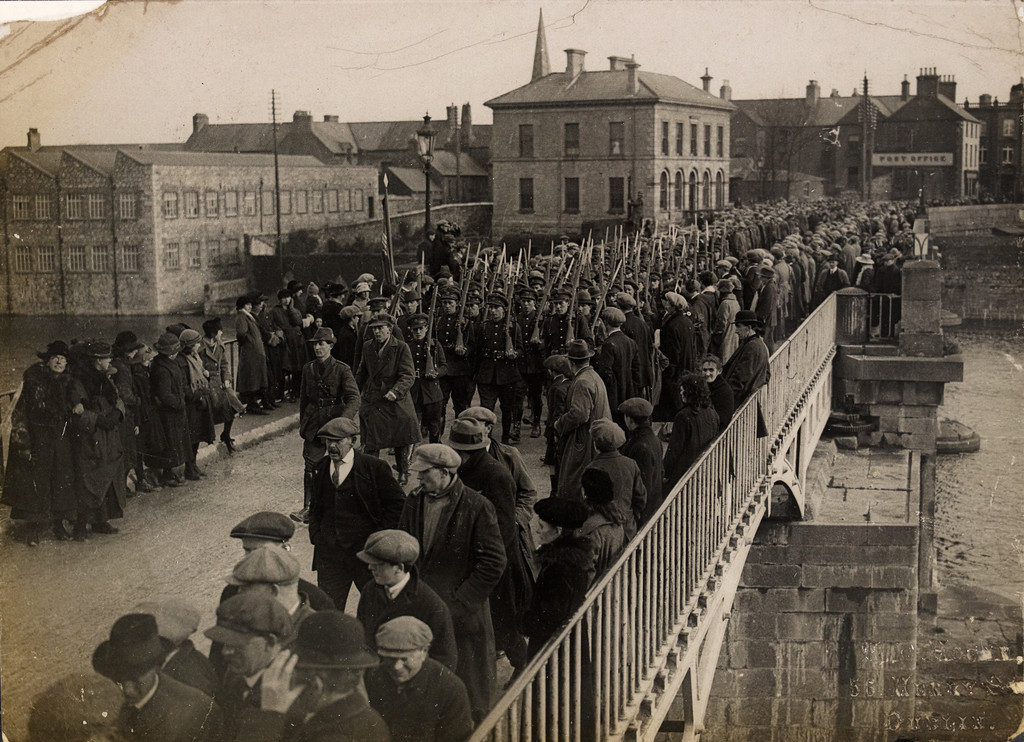 British soldiers walk across the bridge at Athlone after handing over the barracks to Ireland