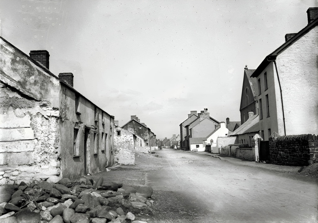 Dilapitaded cottages along the main road through the village (Britannia Place and Wesleyan Chapel)