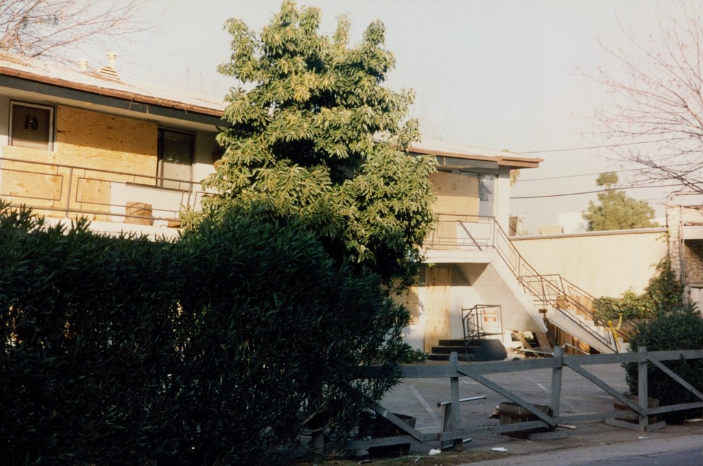 Collapsed, Boarded-up Apartment Building