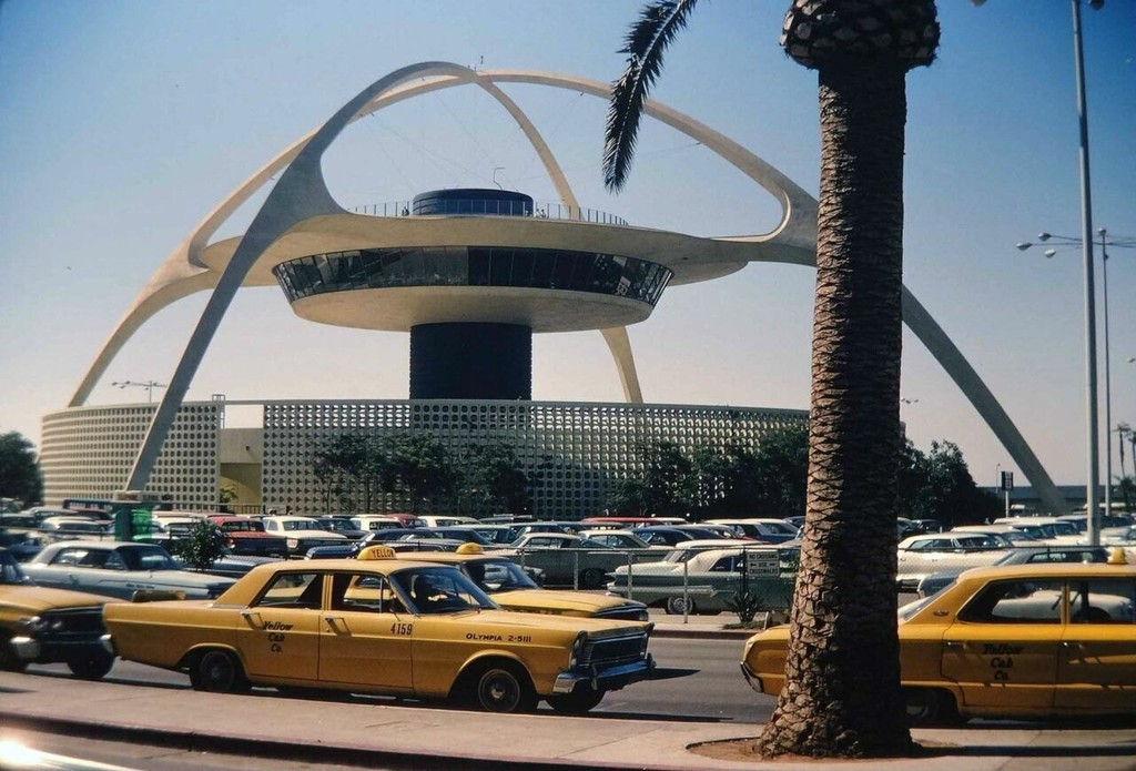 Taxi cabs and the Theme Building at LAX