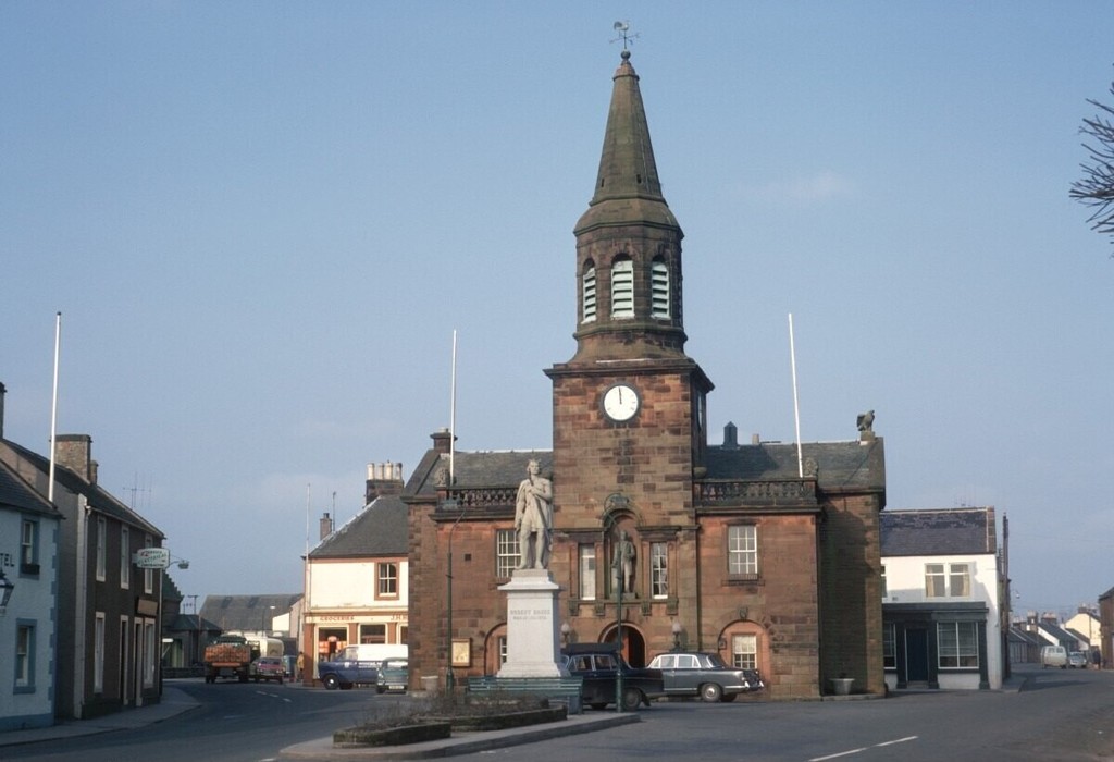 Lochmaben town centre showing the town hall and a statue of Robert Bruce