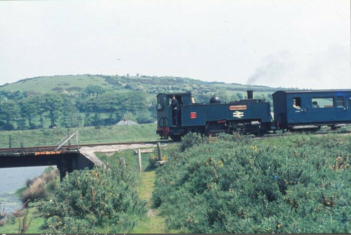 The locomotive, Llewelyn, approaching bridge, driver looking directly at camera