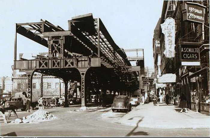 Columbus Avenue looking north from West 65th Street, showing partial demolition of 'El'.
