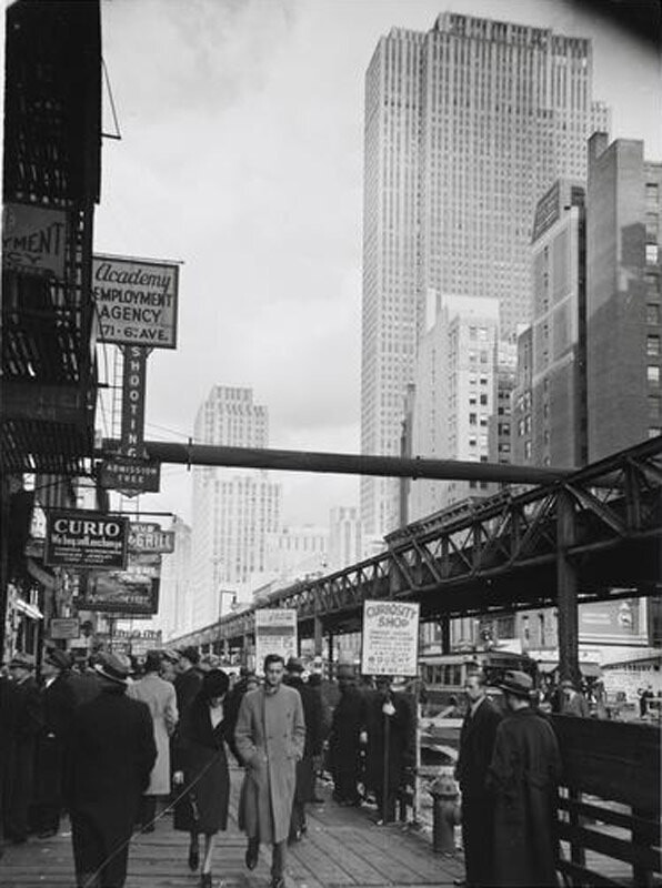 West 45th Street and Sixth Avenue. Street view looking north with elevated train tracks