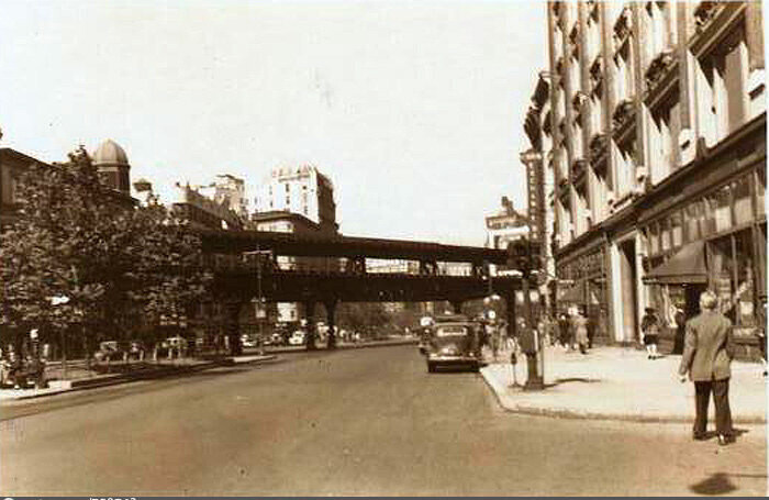 Broadway at southeast corner of 64th Street looking north and showing 'El' tracks before demolition