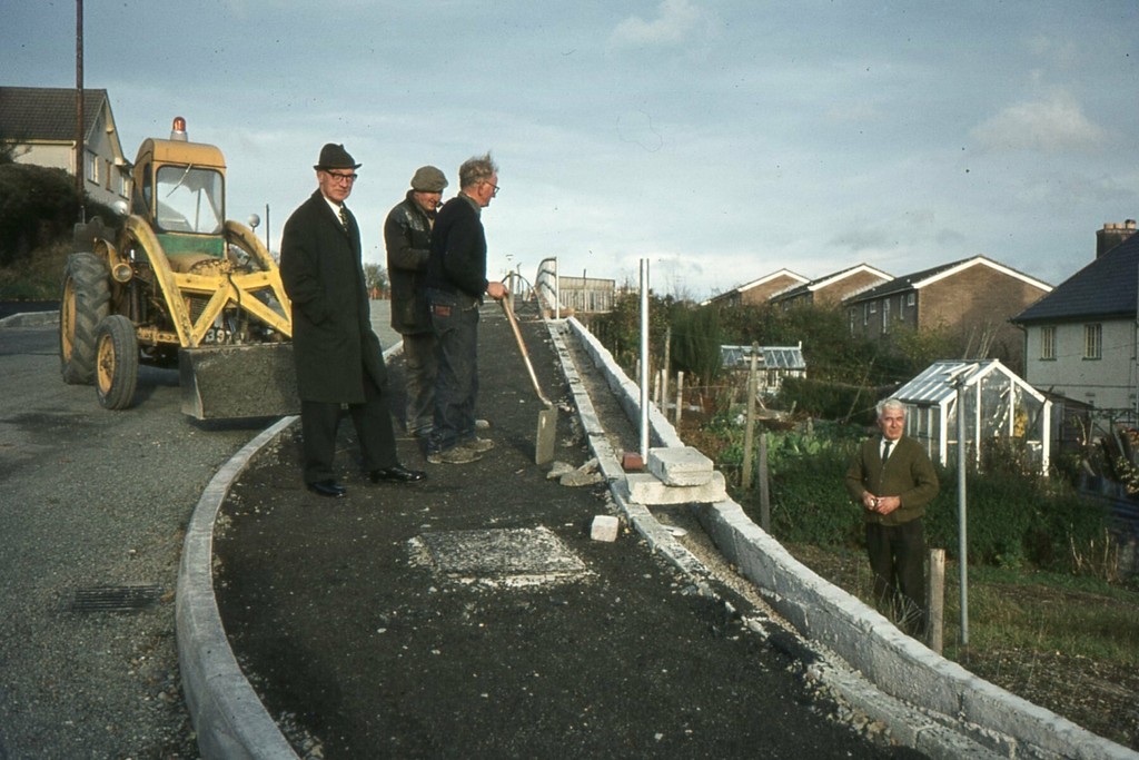 Building of the wall and laying the path behind Green Gardens