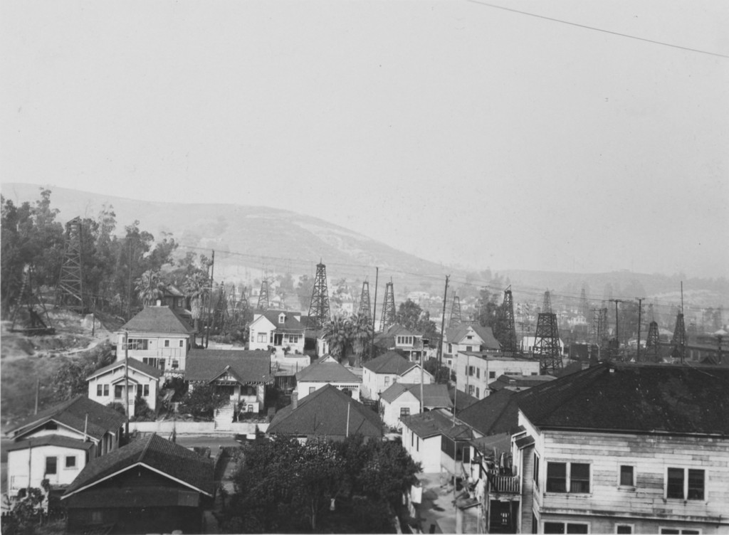 View from Bunker Hill Avenue toward oldest oil derricks, Mexican neighborhood