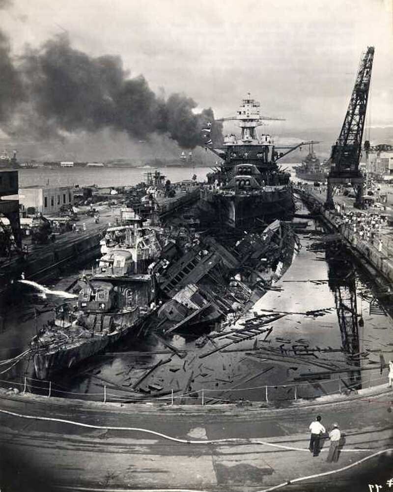 Heavy damage is seen on the battleships U.S.S. Casin and the U.S.S. Downes