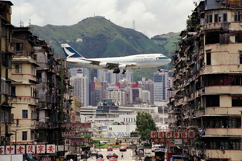 Cathay Pacific jet between apartment buildings in Kowloon City