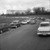 Avenue Appia: l'OMS et voitures garées le long de la route