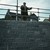 Man standing atop a newly built retaining wall