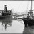 Tugboat and the vessels Robert Fulton and Lettie G. Howard docked at piers 15-17