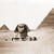 Sphinx head and pyramids