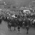 Workers crowd round Major Yuri Gagarin's car