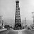 Oil derrick straddles La Cienega Blvd