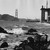 View of Golden Gate Bridge construction and Fort Point from Baker Beach